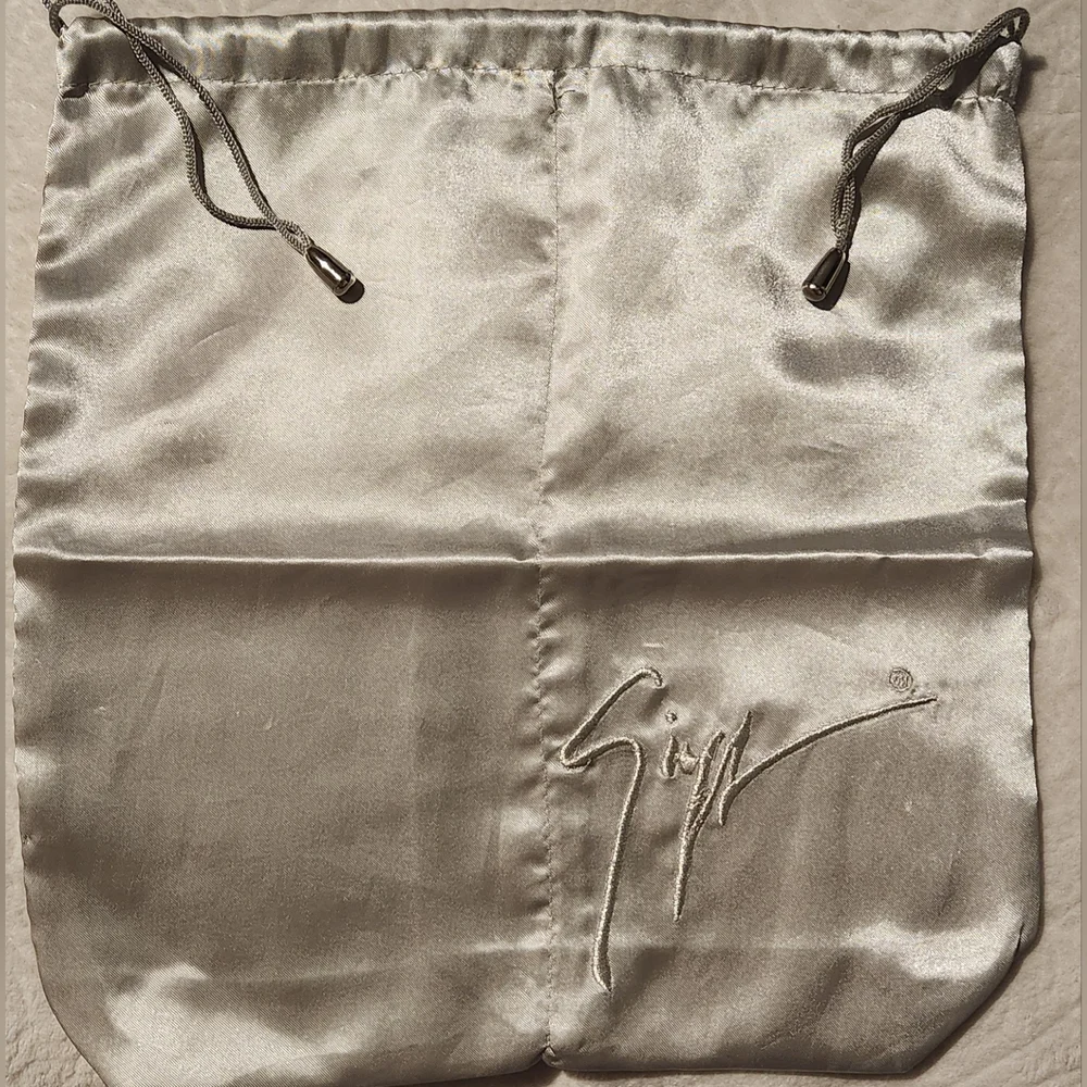 Jennifer Lopez Silk Drawstring Silver Bag with Signature Logo